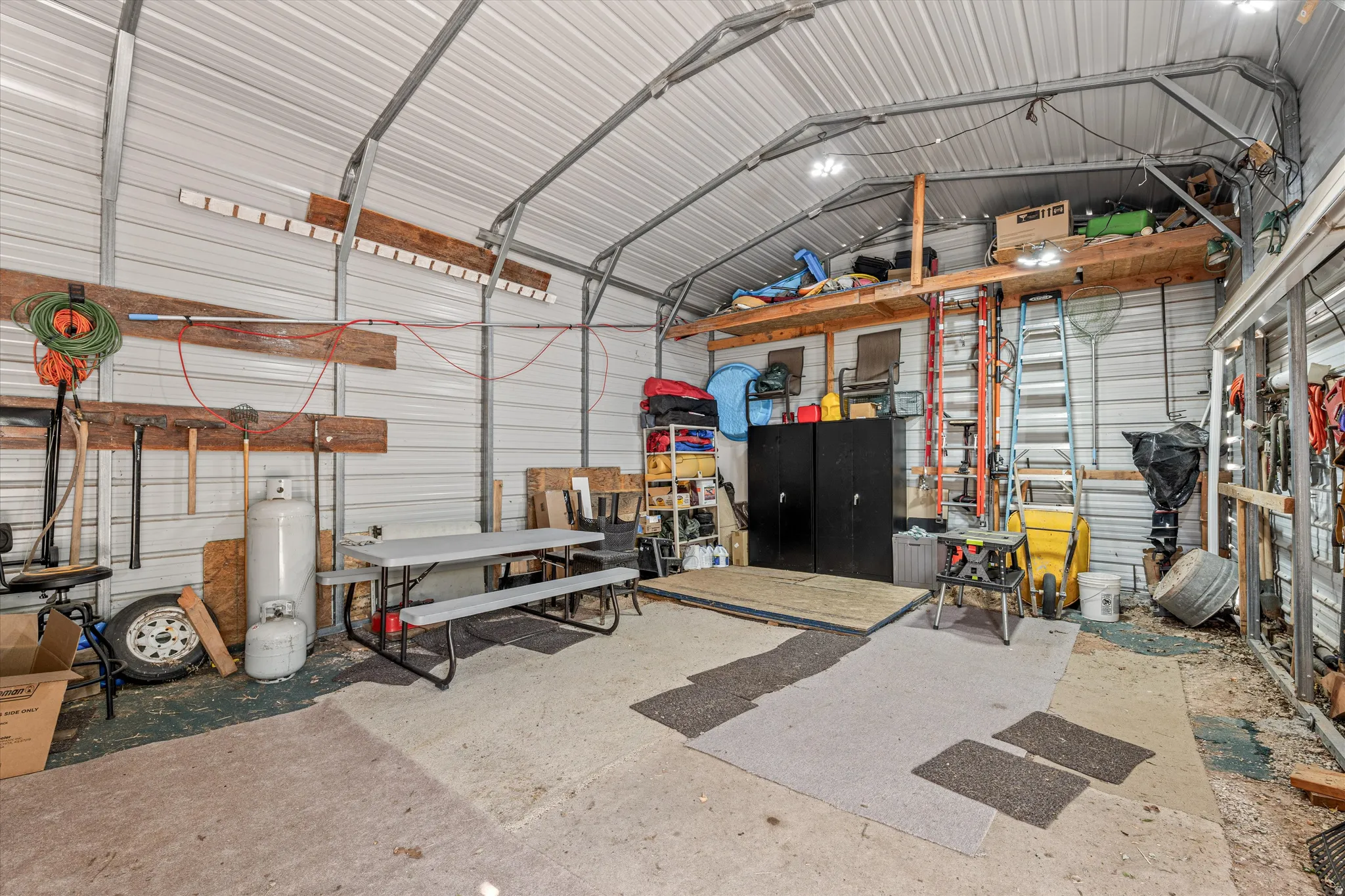 Garage featuring metal wall