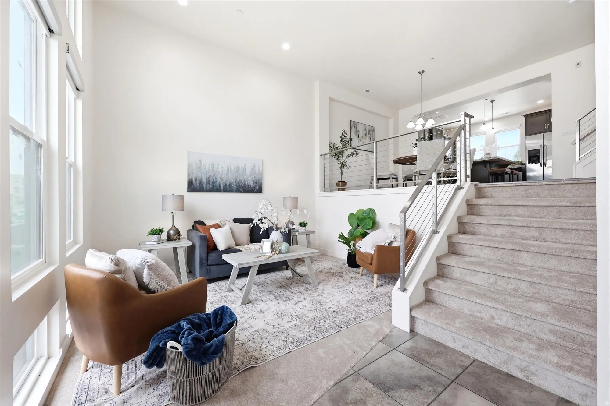 Living room with hanging lights and tile patterned flooring