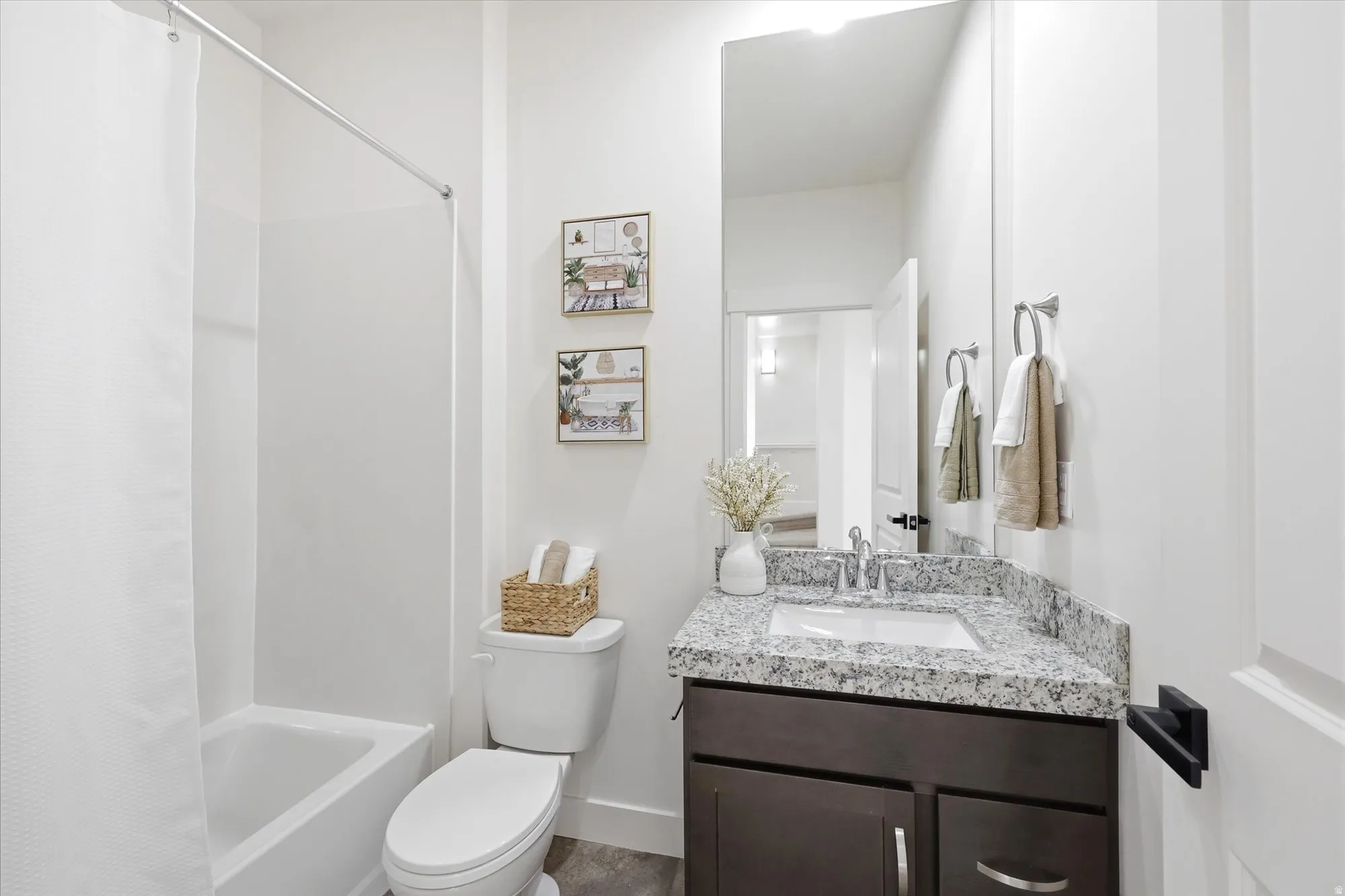 Full bath with vanity and shower / bath combination with curtain