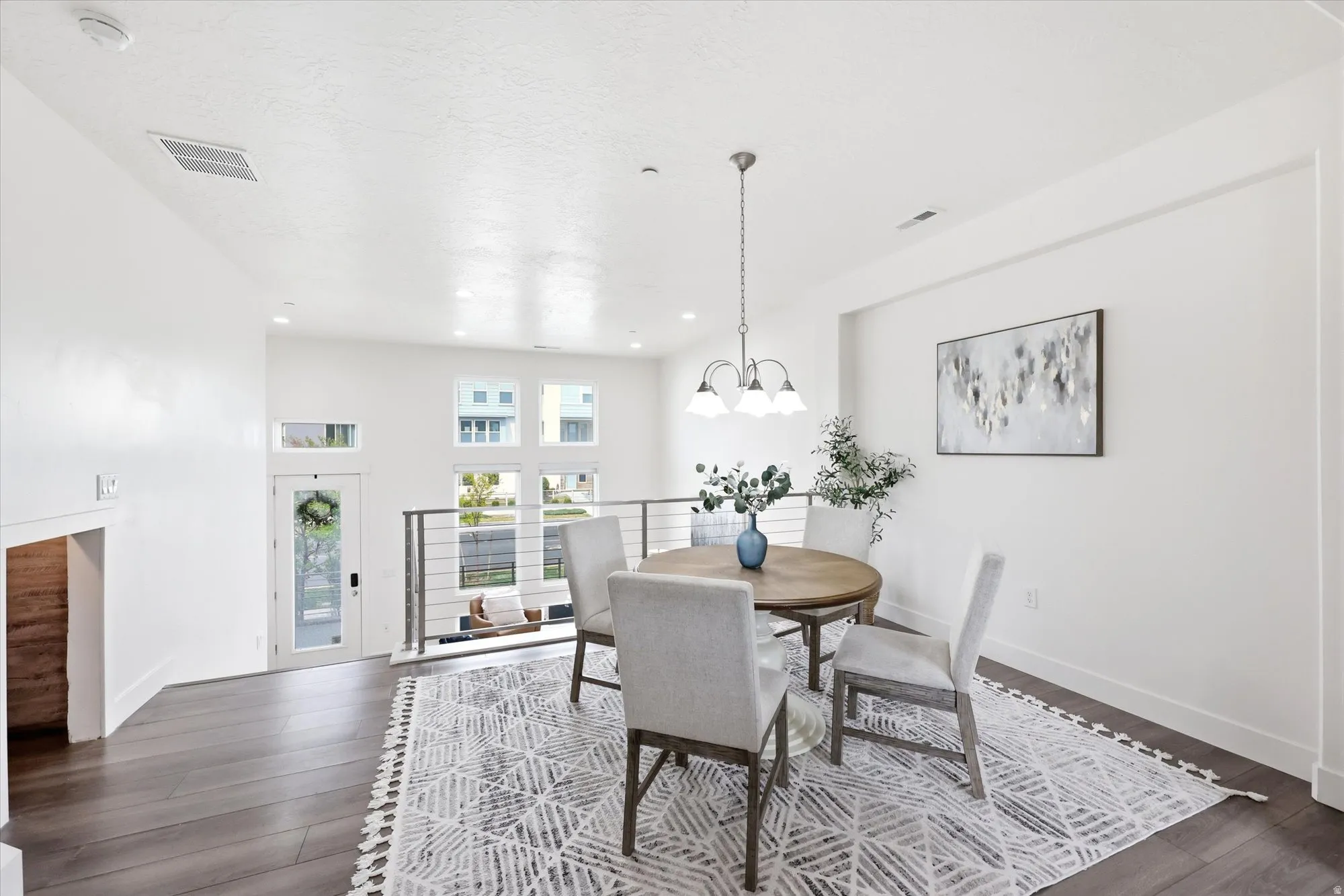 Dining space featuring dark wood-type flooring and a chandelier