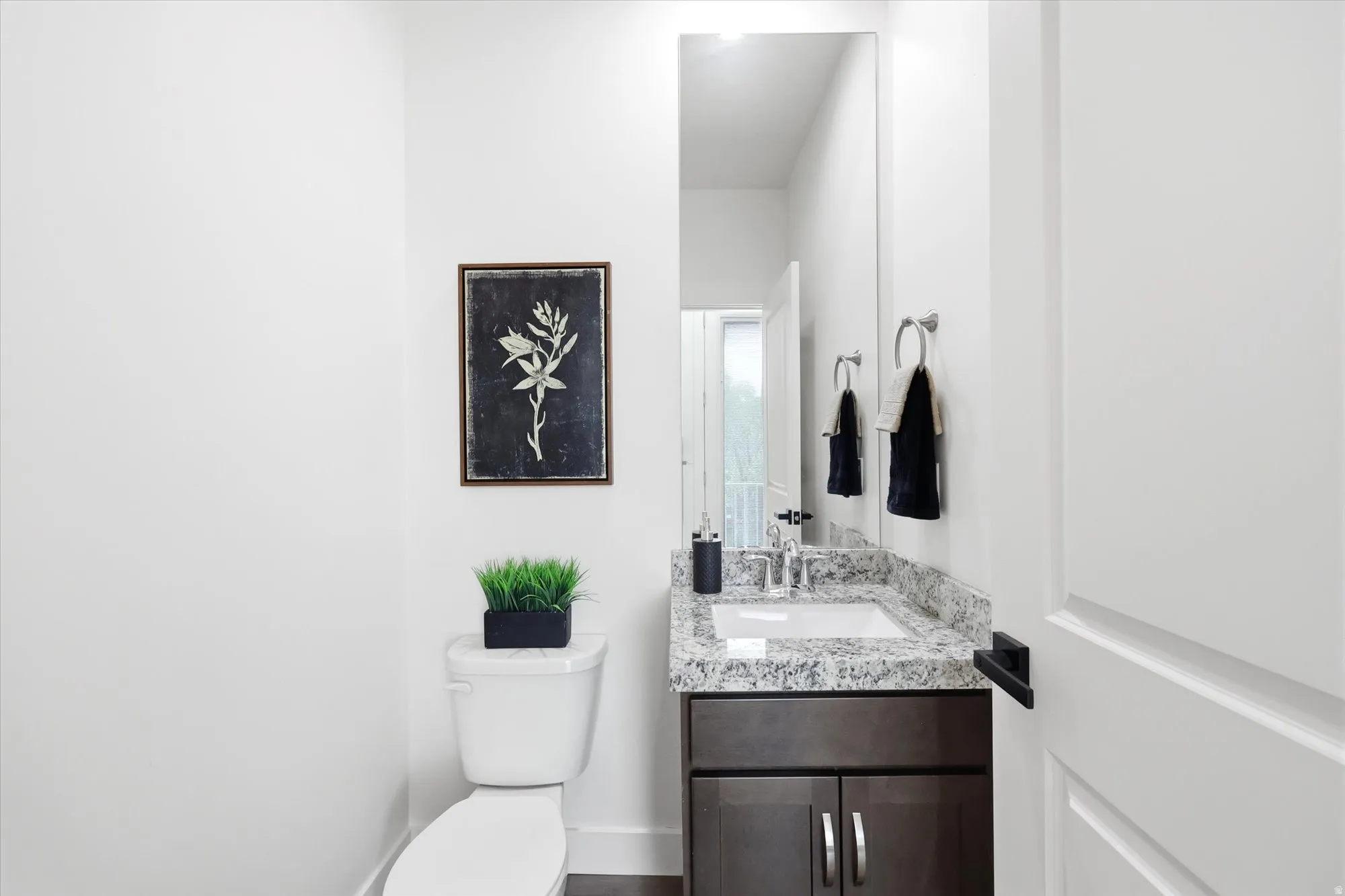 Half bath with toilet and vanity