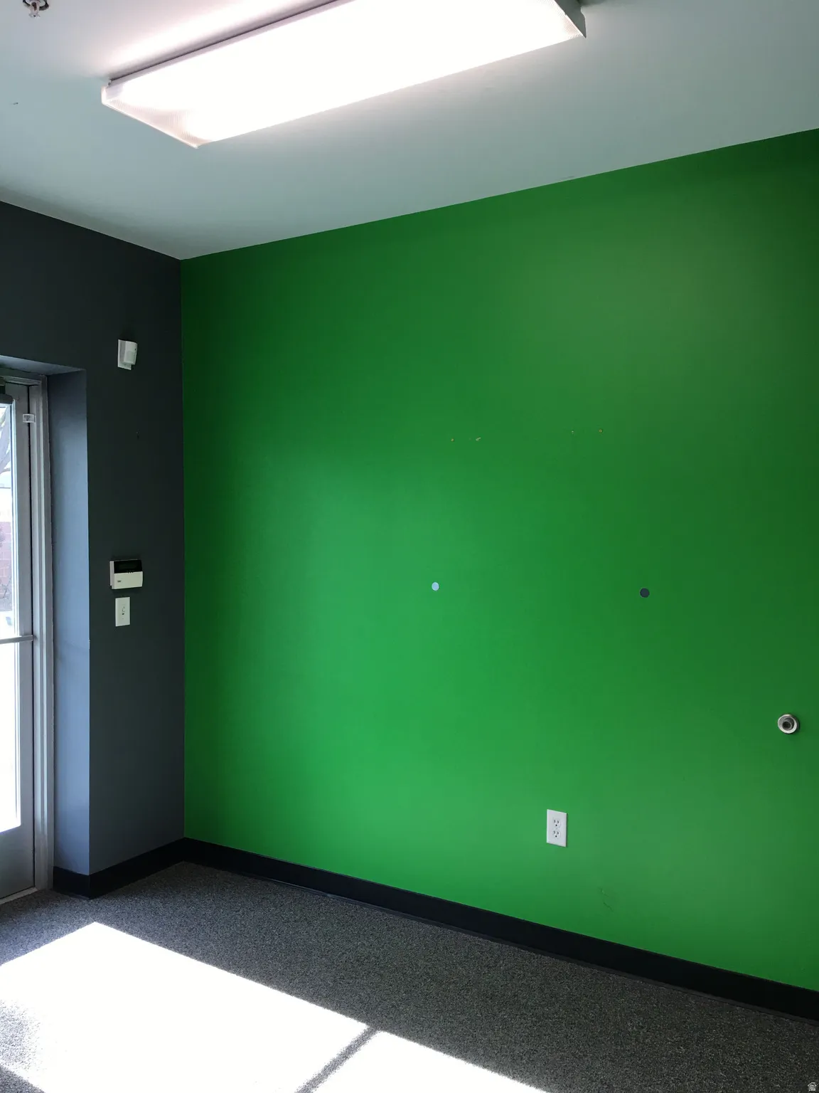 Unfurnished room with baseboards