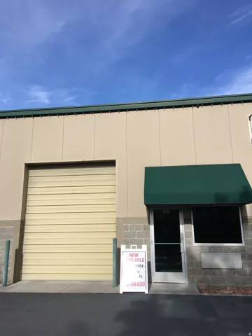 View of property featuring a garage