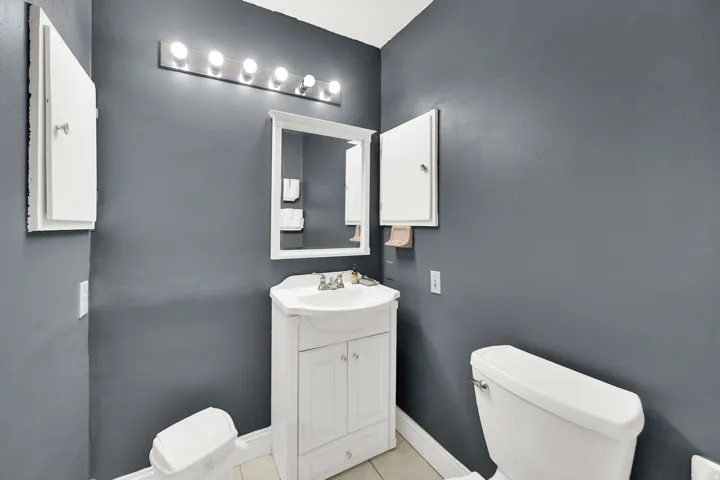 Bathroom featuring vanity and light tile patterned floors