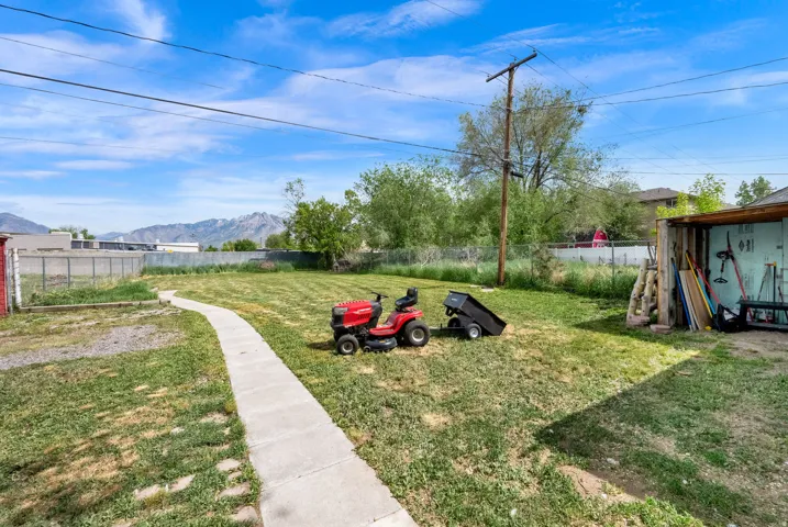 Fenced yard with a mountain view