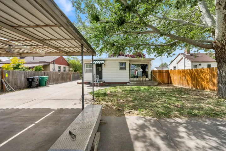 Fenced backyard with a patio area
