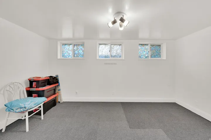 Sitting room with carpet flooring and baseboards