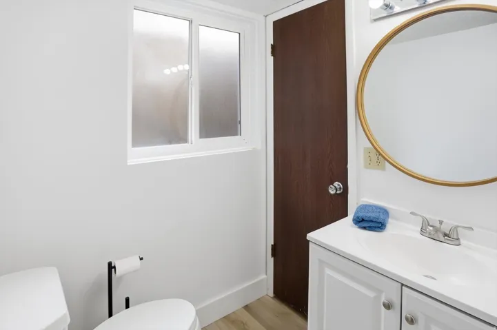 Bathroom with vanity and light wood-style floors