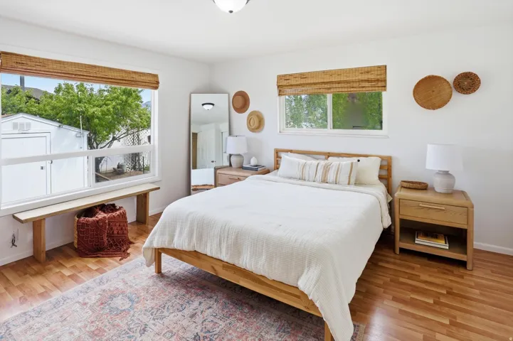 Bedroom featuring light wood-style floors and baseboards