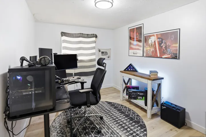 Office with light wood-style floors and baseboards