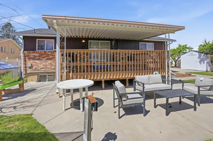 View of patio / terrace with outdoor seating and a shed