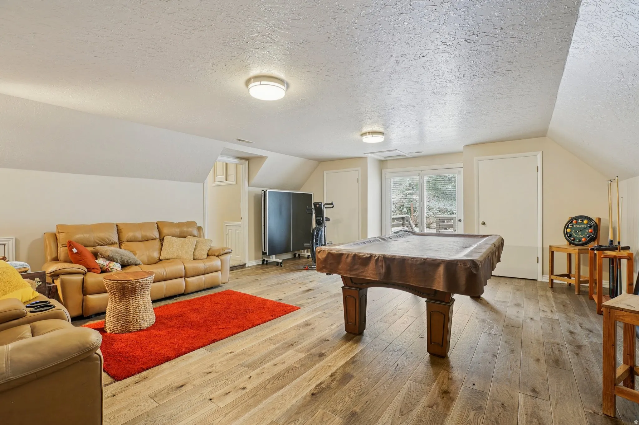 Playroom featuring pool table and light wood-type flooring