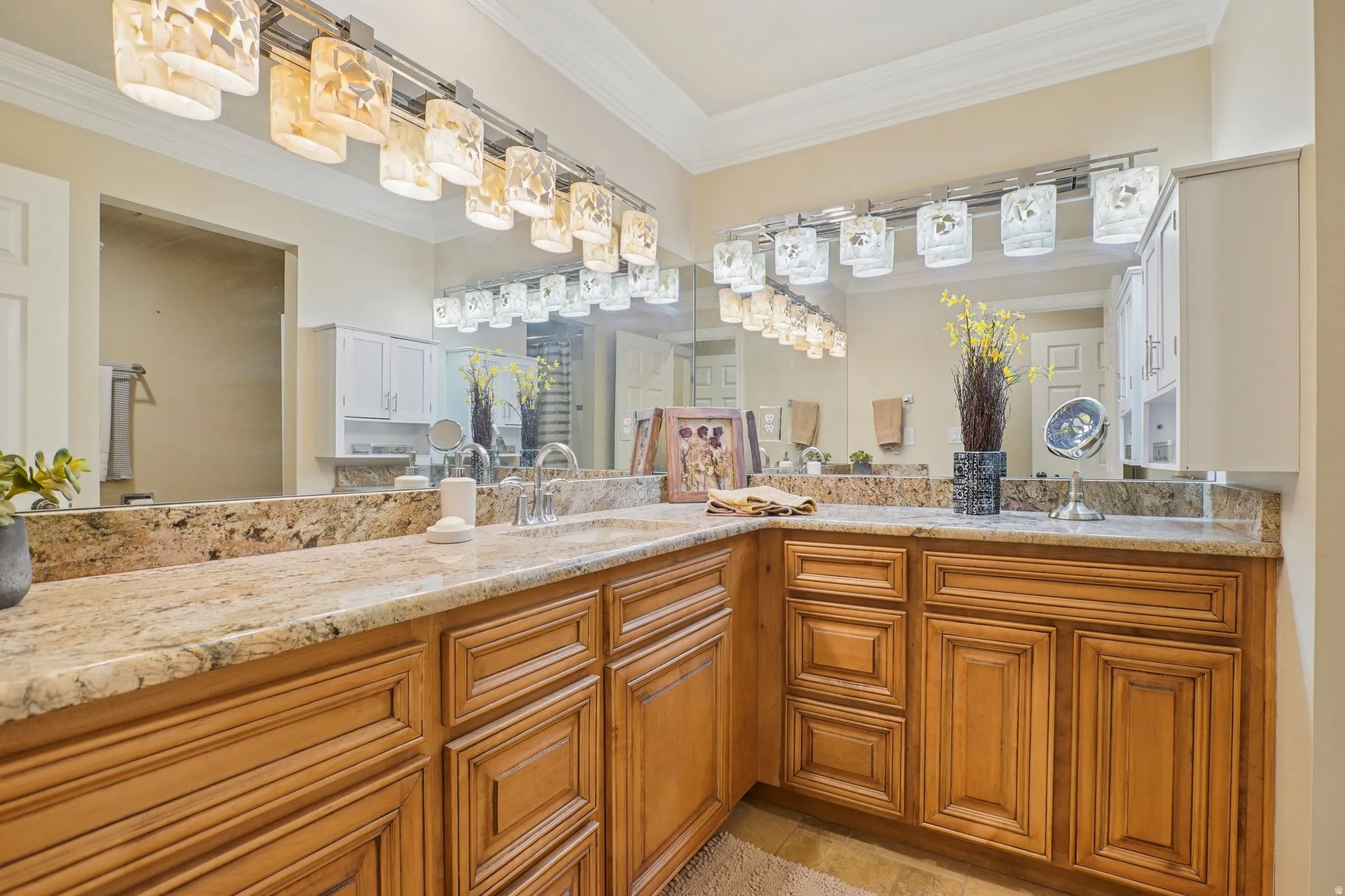 Full bath with vanity and crown molding