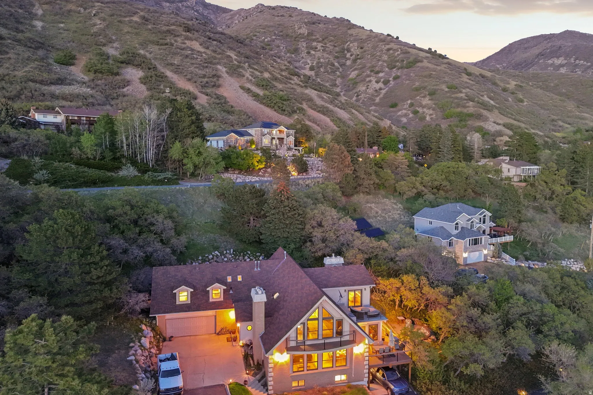Aerial view at dusk of a mountain view and view of scattered trees