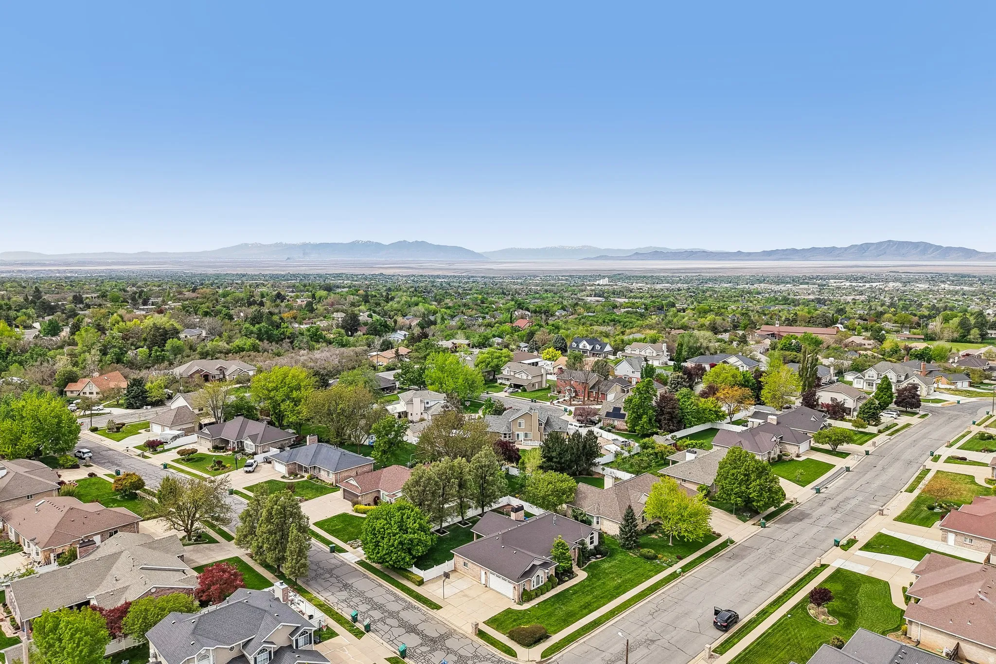 Aerial perspective of suburban area with mountains