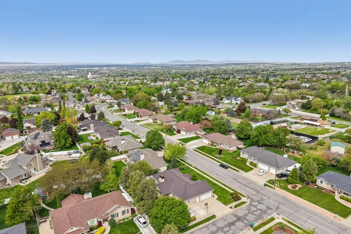 Aerial perspective of suburban area with a mountain backdrop
