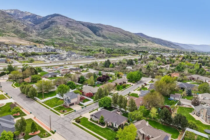 Aerial view of residential area featuring a mountainous background