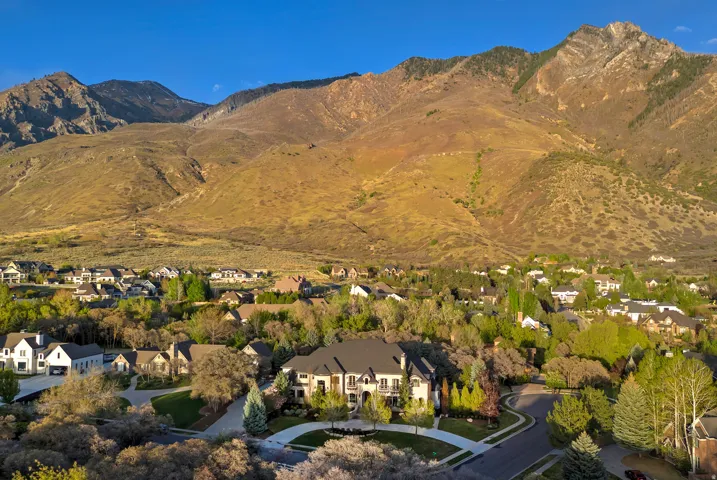 Aerial view of residential area featuring mountains