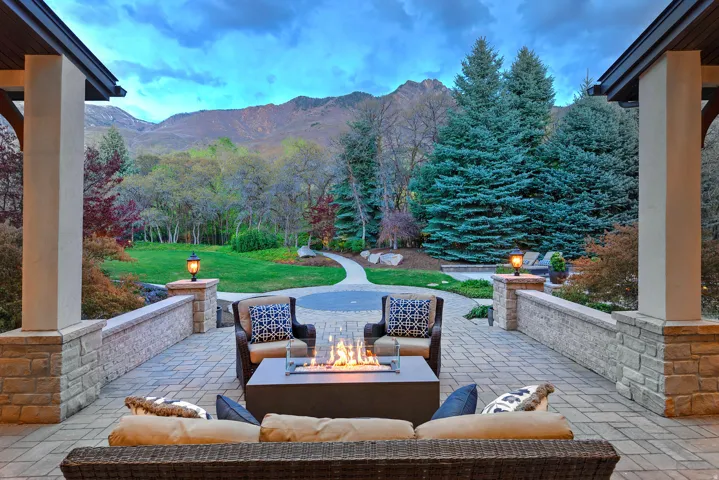 View of patio / terrace with a mountain view and an outdoor living space with a fire pit