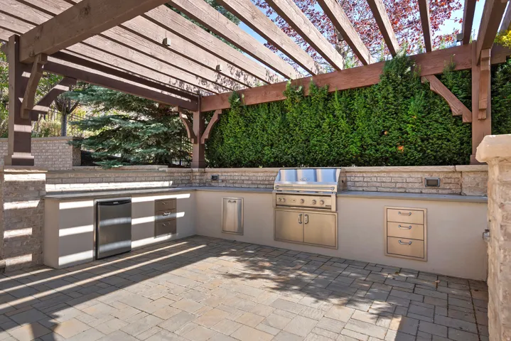 View of patio featuring a pergola and area for grilling
