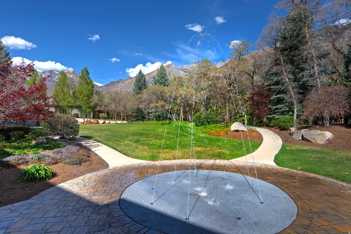 View of grassy yard featuring a mountain view