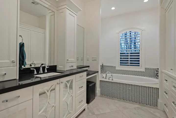 Full bath featuring vanity, a garden tub, and recessed lighting