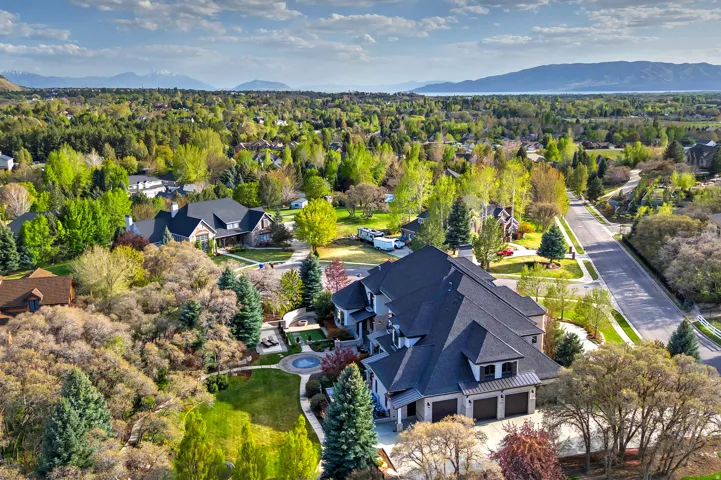 Aerial perspective of suburban area with a mountain backdrop