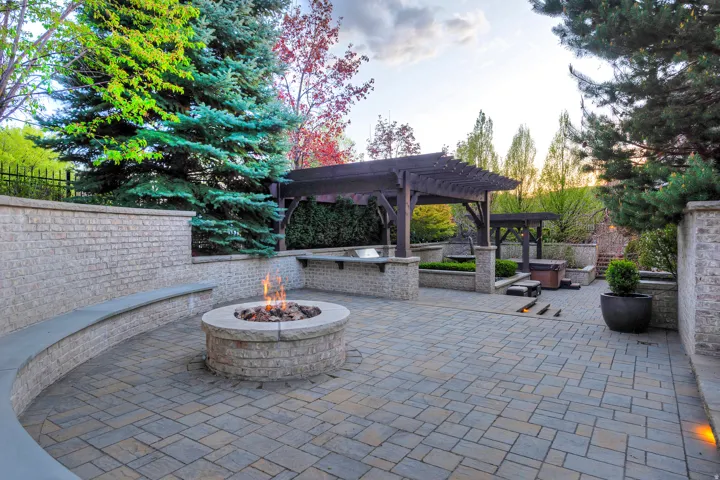 View of patio / terrace with an outdoor fire pit and a pergola