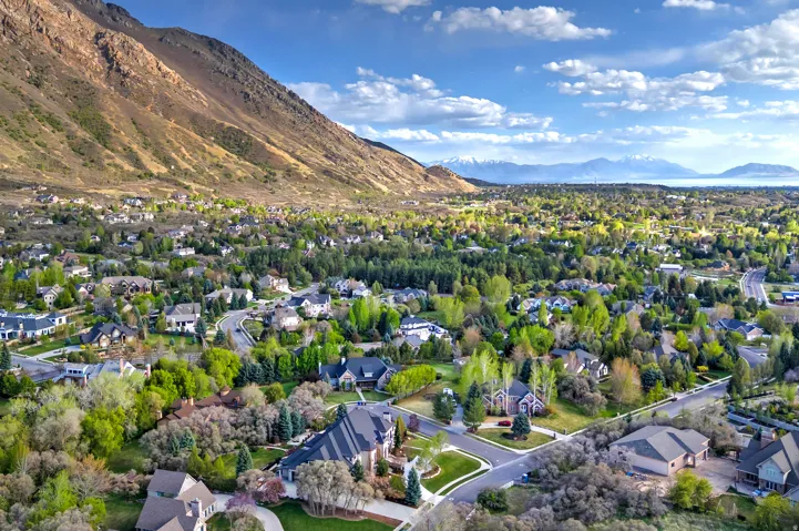 Aerial view of residential area featuring mountains