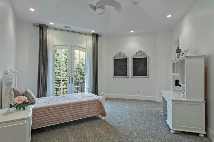 Carpeted bedroom with french doors, access to outside, and recessed lighting