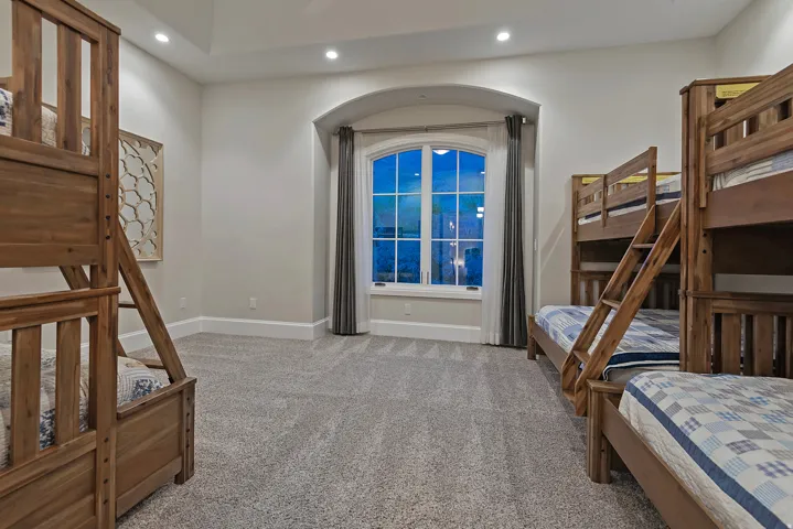 Bedroom featuring light carpet and recessed lighting