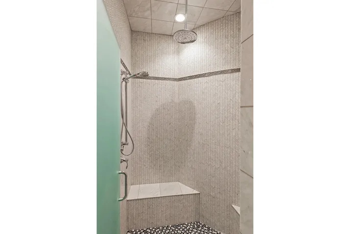Bathroom featuring a shower stall