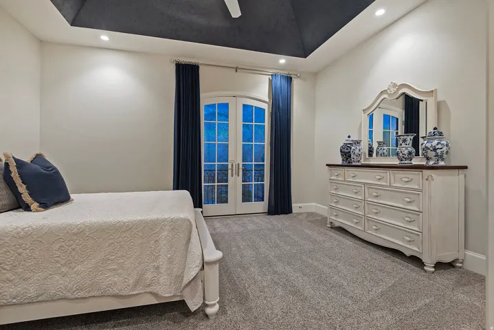 Carpeted bedroom featuring french doors, ceiling fan, access to exterior, and recessed lighting