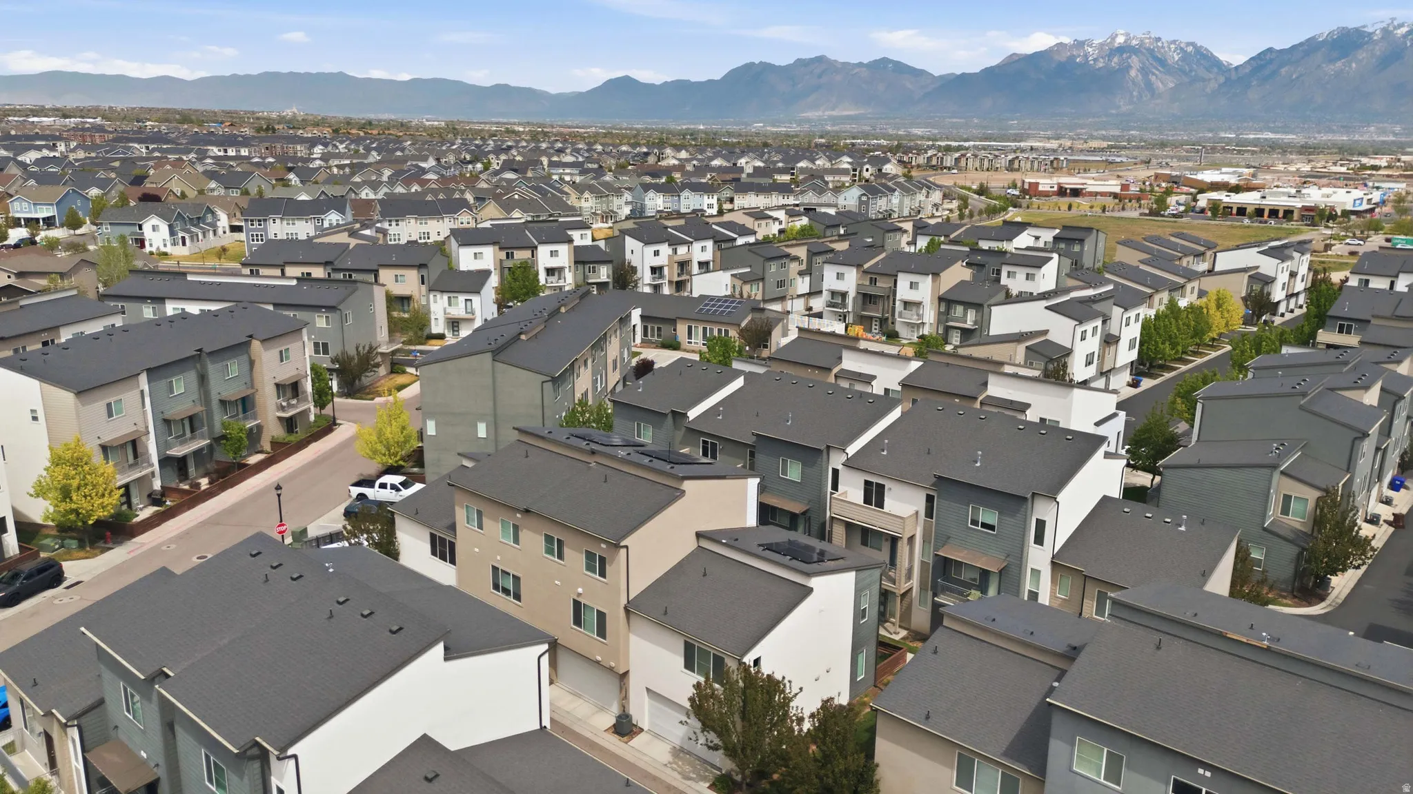 Aerial view of residential area featuring mountains