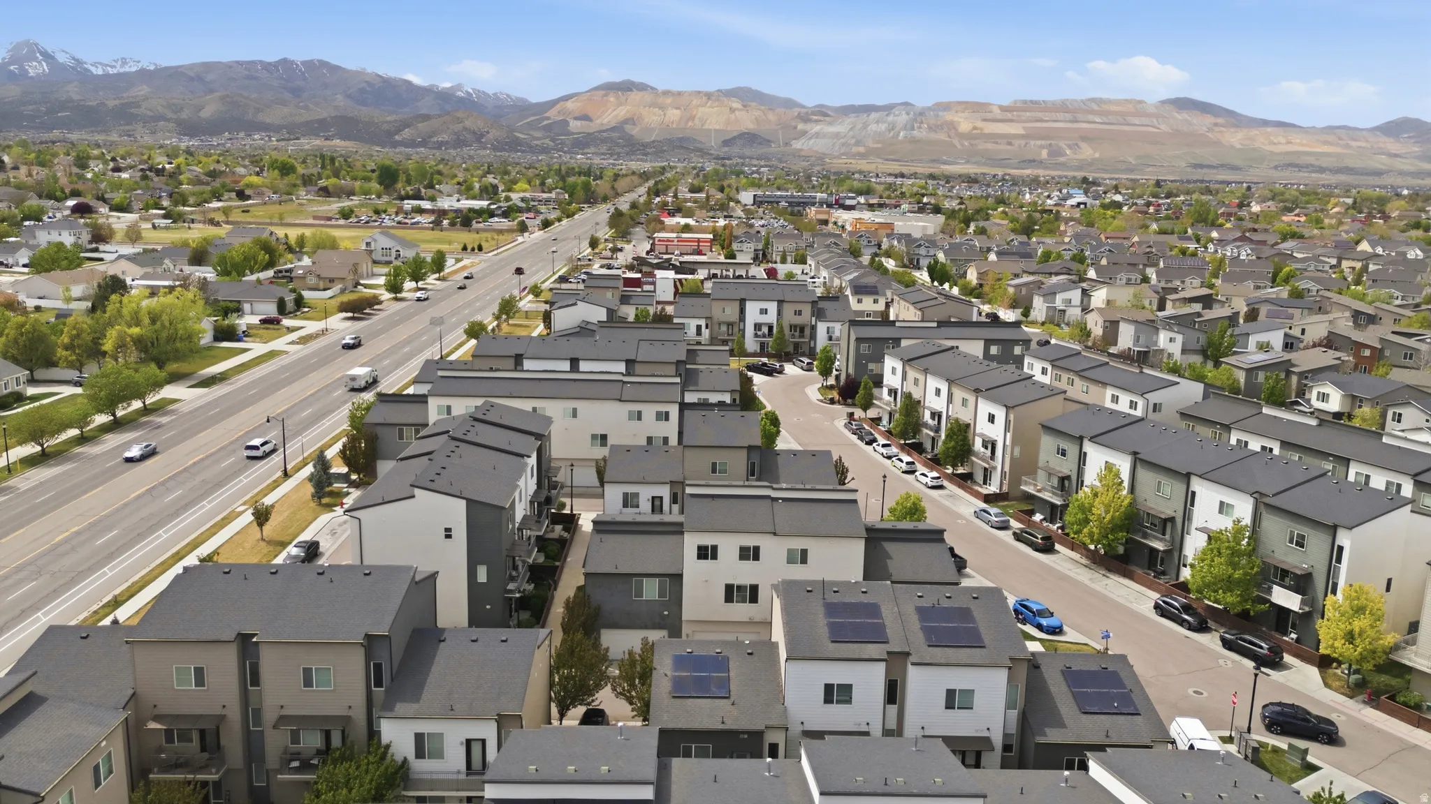 Aerial view of property's location with nearby suburban area