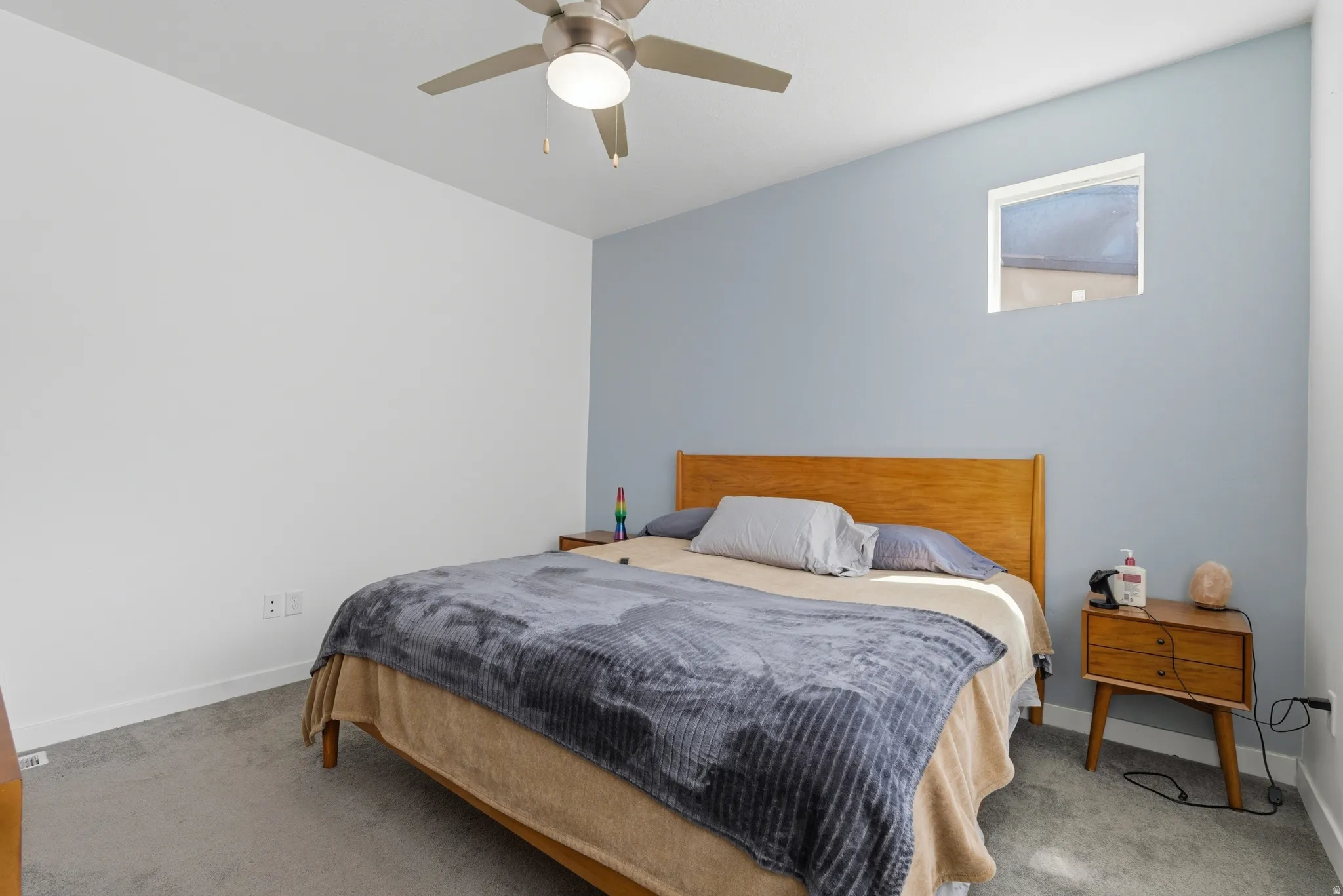 Bedroom featuring carpet and a ceiling fan
