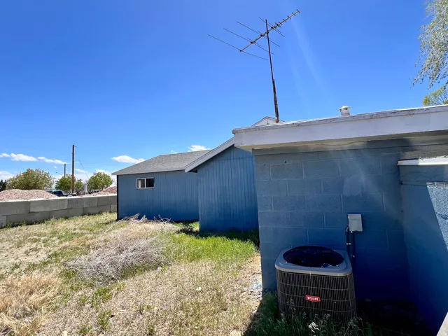 View of side of home featuring a central AC unit