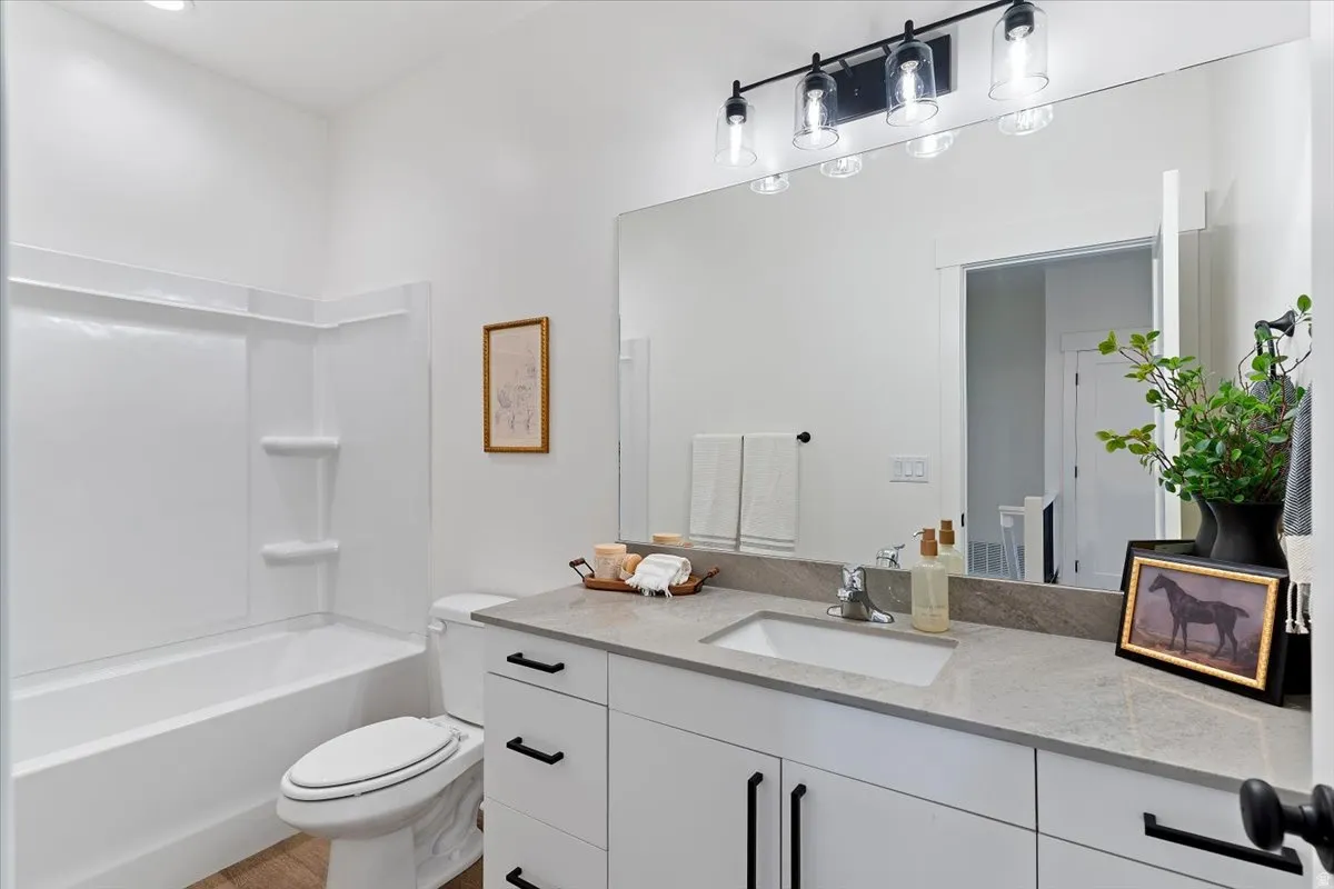 Full bathroom featuring vanity and bathing tub / shower combination