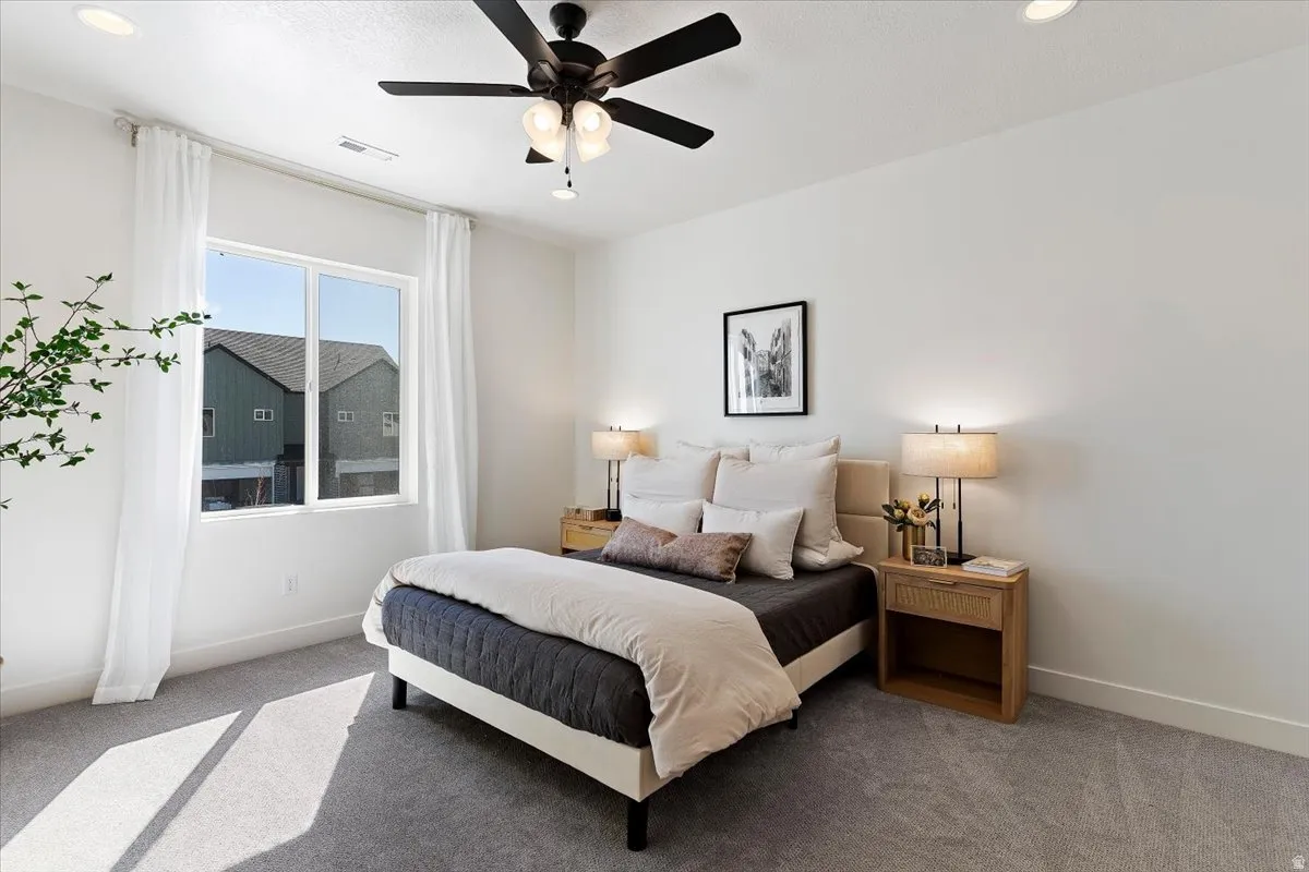 Bedroom with carpet, a ceiling fan, and recessed lighting