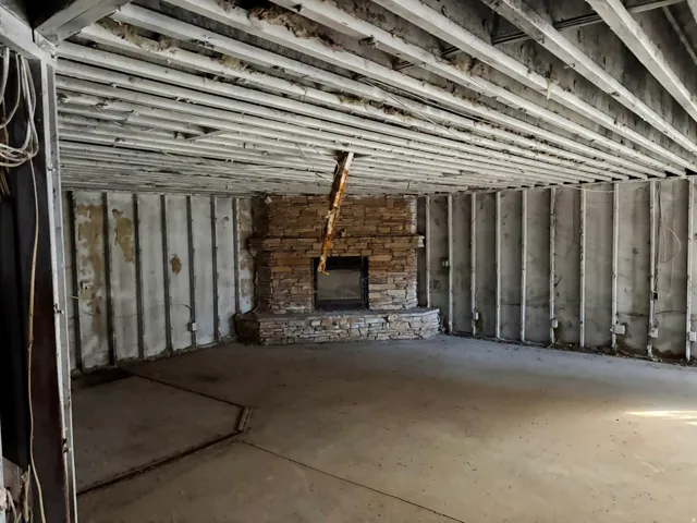 Unfurnished living room featuring a fireplace