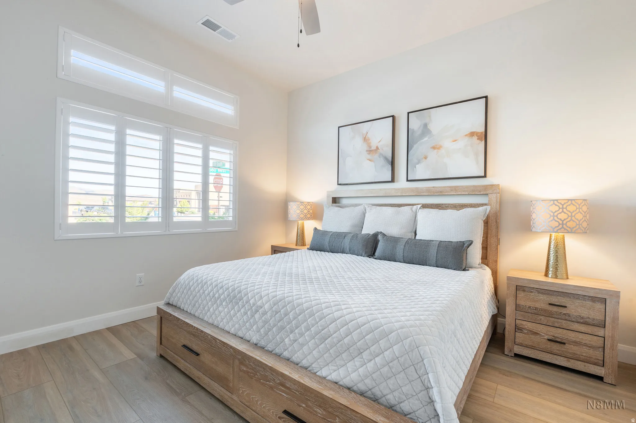 Bedroom with light wood-style flooring and ceiling fan