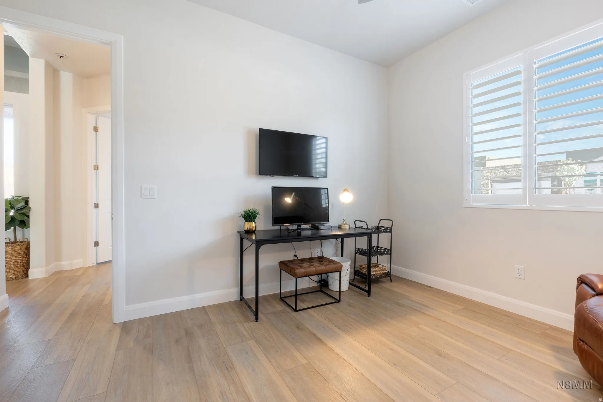 Office area featuring light wood-style flooring and plenty of natural light