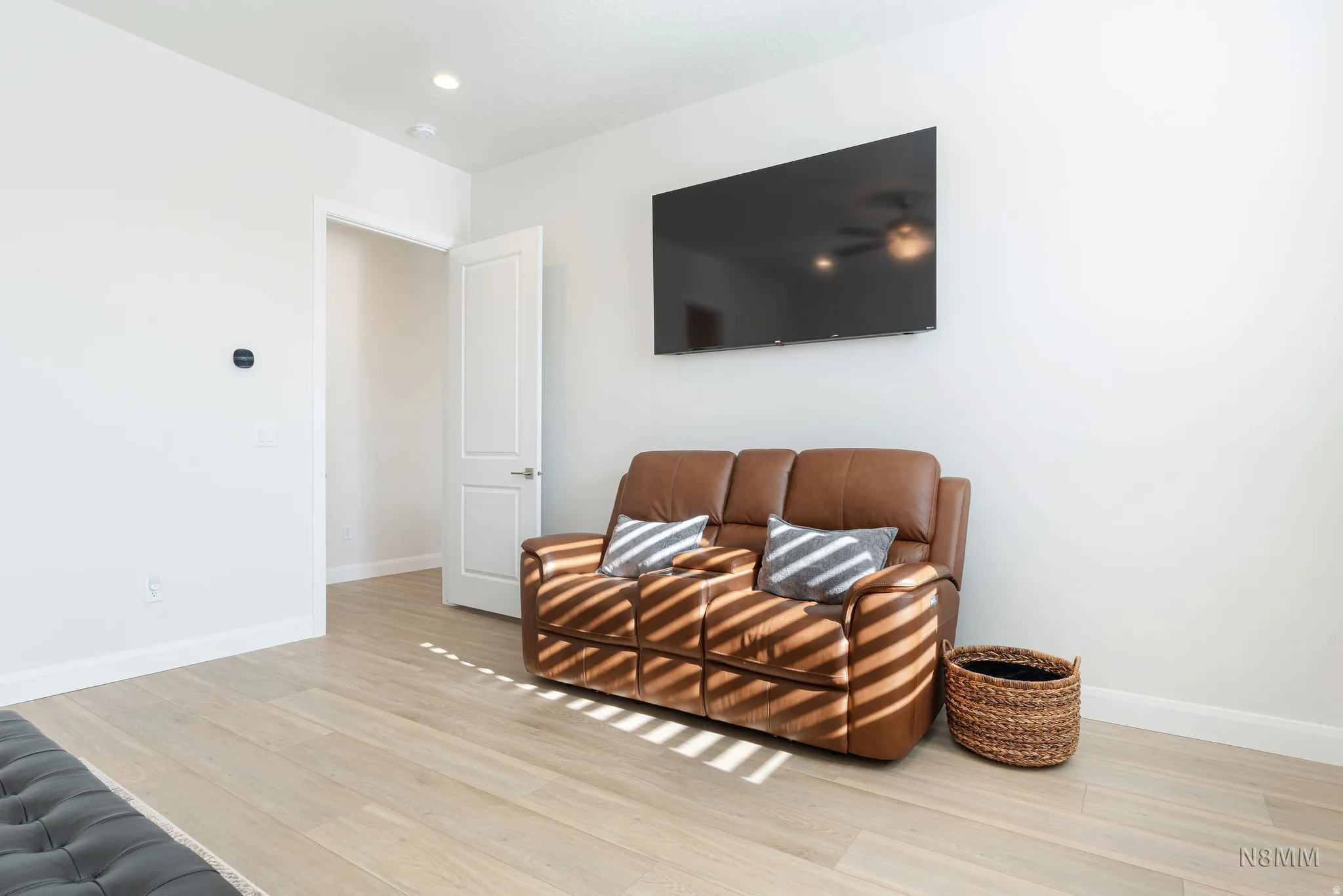 Sitting room featuring light wood-type flooring and recessed lighting