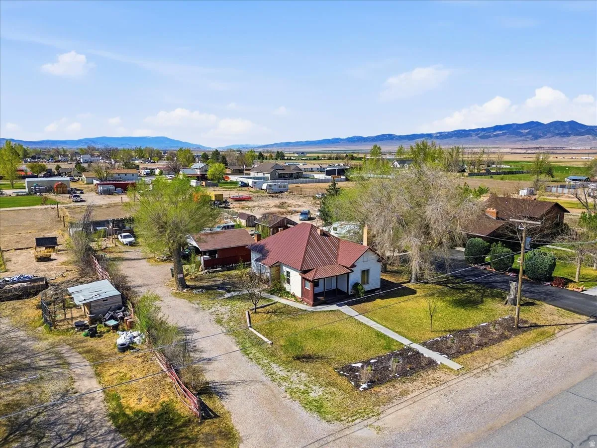 Aerial perspective of suburban area with a mountainous background