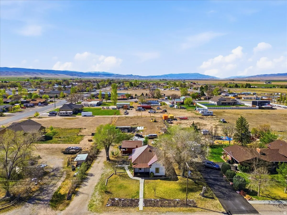 Aerial view of residential area featuring a mountainous background