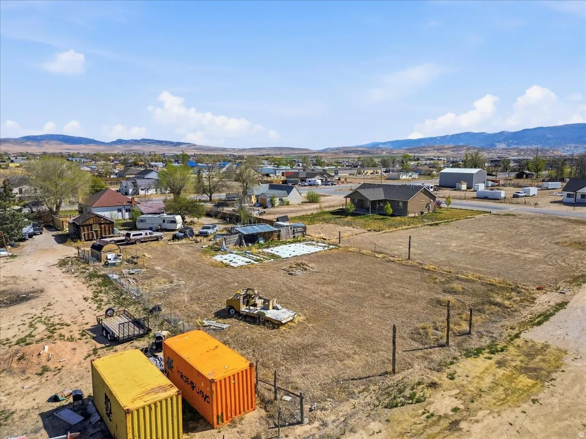 Aerial perspective of suburban area featuring a mountain backdrop