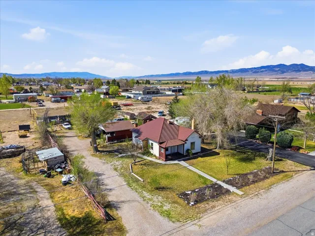 Aerial perspective of suburban area with a mountainous background