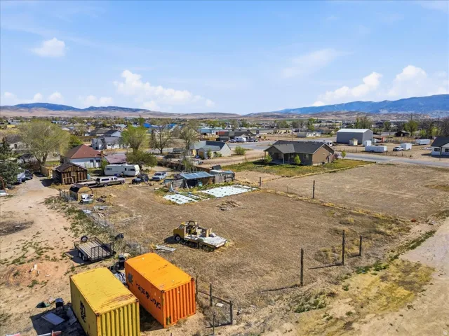 Aerial perspective of suburban area featuring a mountain backdrop