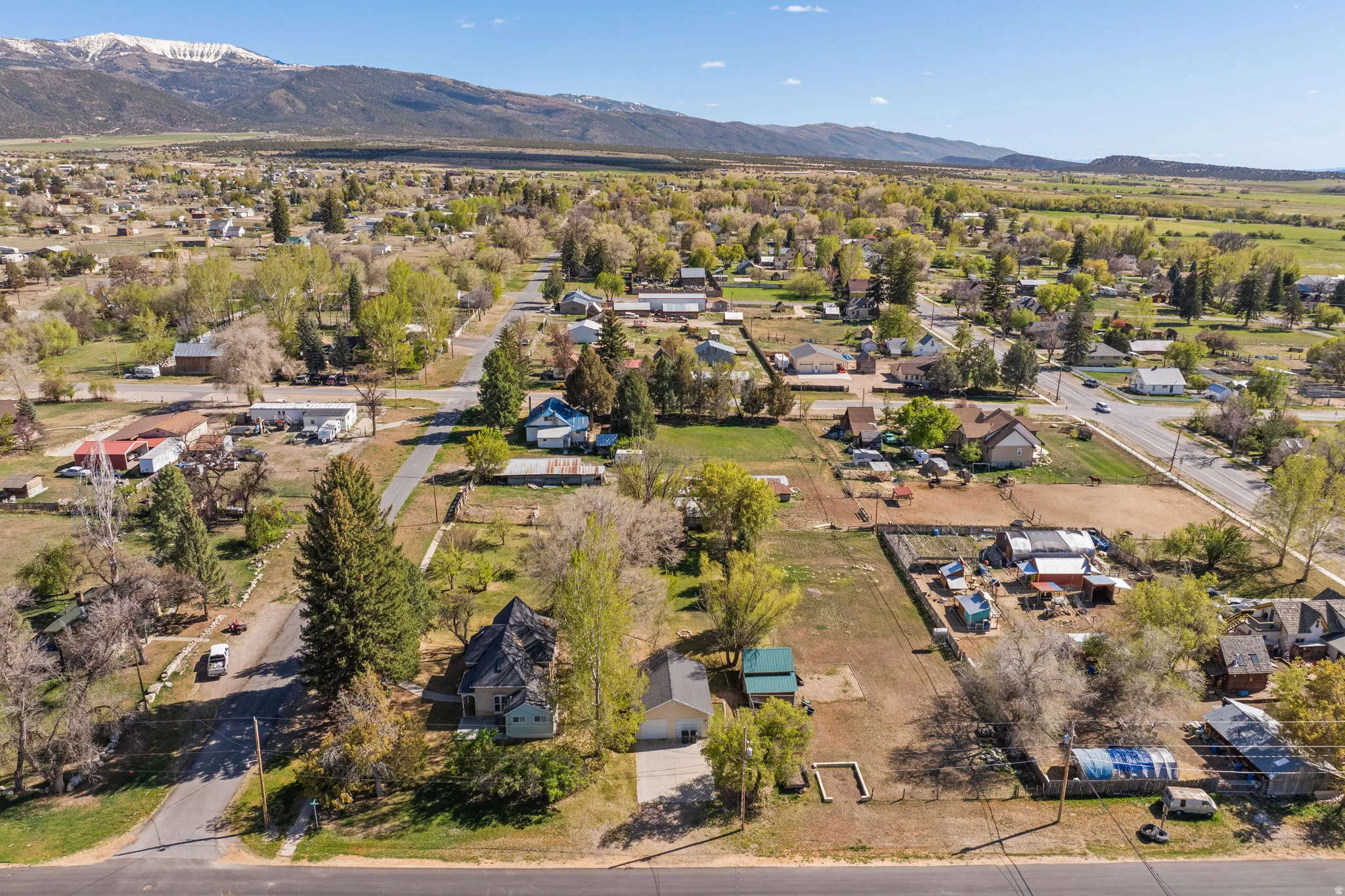 Aerial perspective of suburban area with a mountainous background
