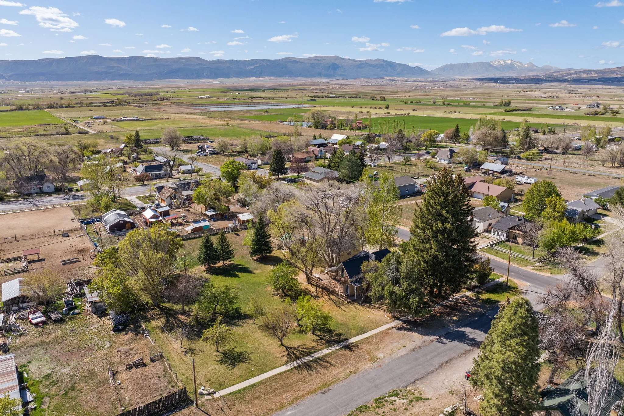 Aerial view of residential area featuring a mountainous background